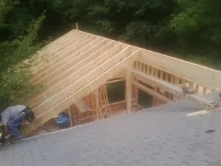 Framing a new roof addition that ties into an existing shingle roof in Evanston